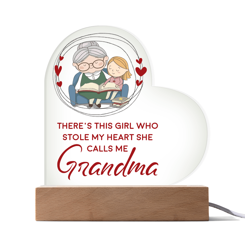 Heart Acrylic Plaque.(THERE'S THIS GIRL WHO STOLE MY HEART SHE CALLS ME  GRANDMA.)